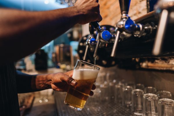 pouring pint in pub