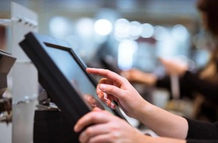 person pressing epos touchscreen