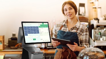 woman stood with epos till system