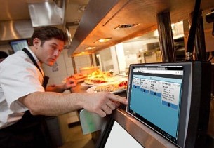 man using kitchen display screen