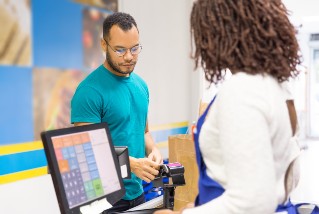 person being served at till