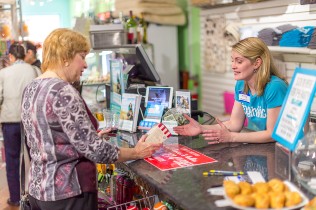 woman being served at pet shop counter