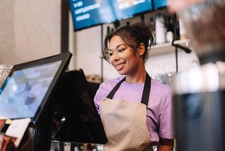 woman using epos till
