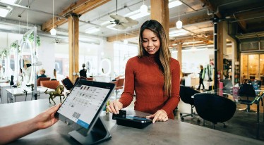 woman using till system