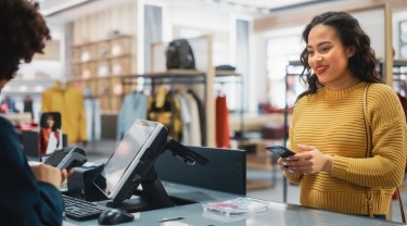 woman being served at POS system