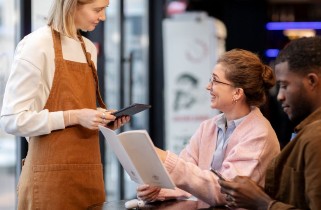 customer being served with handheld tablet