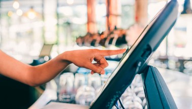 person touching epos screen